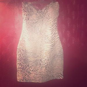 Women’s size small strapless gold print dress.